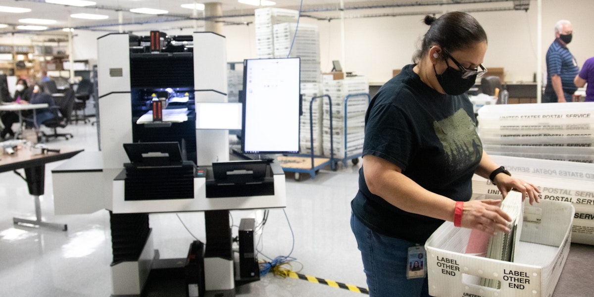 PHOENIX, AZ - OCTOBER 31: A Maricopa County Elections Department staff member counts ballots ahead of Tuesdays election on October 31, 2020 in Phoenix, Arizona. Early voting lasted from October 7th through the 30th in Arizona, which had a record number of early voters. (Photo by Courtney Pedroza/Getty Images)