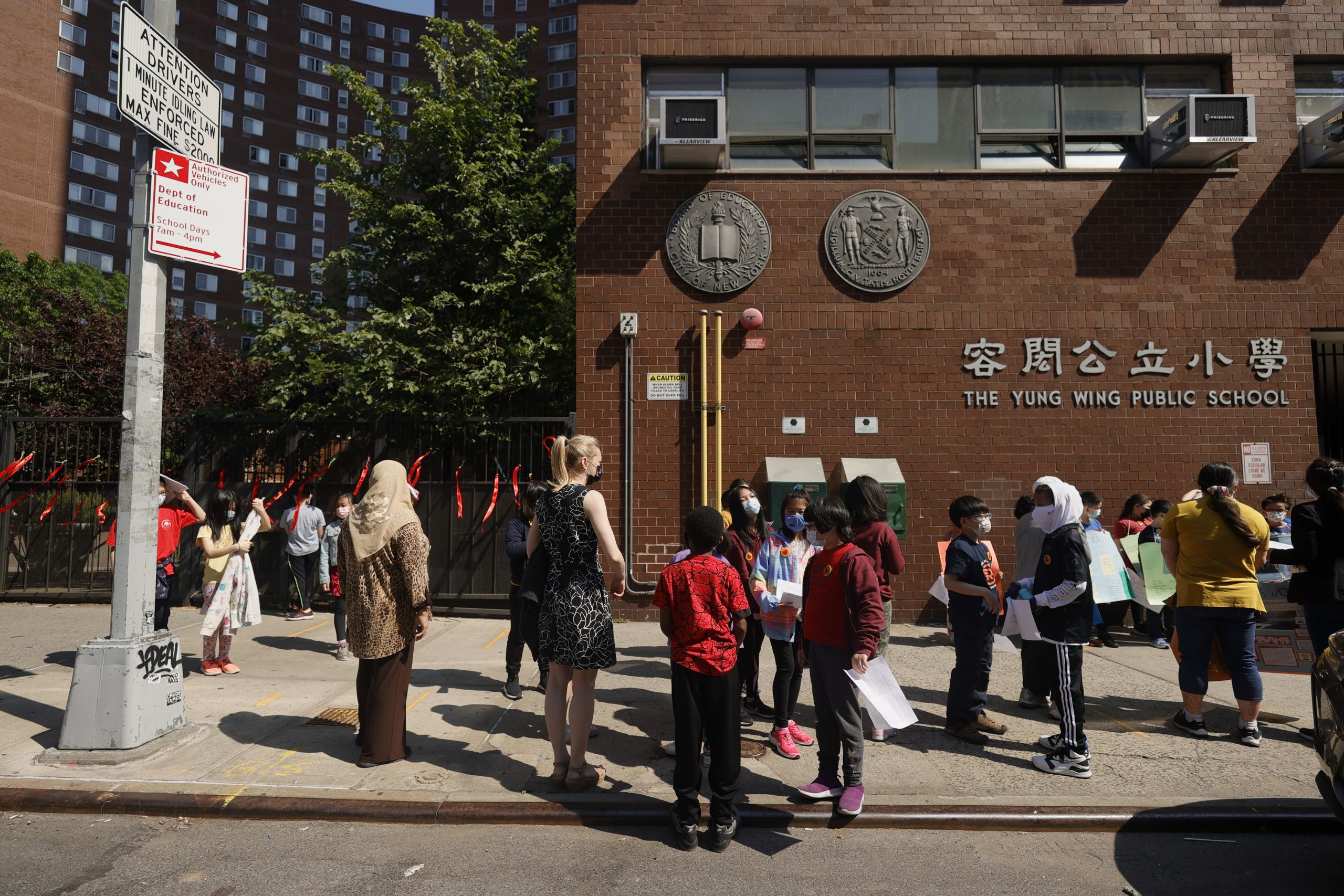 NEW YORK, NEW YORK - MAY 21: Students and faculty join together in front of Yung Wing School P.S. 124 on May 21, 2021 in New York City. May is Asian/Pacific American Heritage month and awareness has spiked due to incidents of Asian racism and other acts of hatred in the age of COVID-19. Schools across the Lower East Side held rallies in response to the recent violence against the AAPI community.  (Photo by Michael Loccisano/Getty Images)