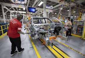 DETROIT, MI - JUNE 10:  Stellantis workers install doors on a 2021 Jeep Grand Cherokee L at the Stellantis Detroit Assembly Complex-Mack on June 10, 2021 in Detroit, Michigan. The plant is the first new auto assembly plant in Detroit in thirty years, and will manufacture the 2021 Jeep Grand Cherokee L. (Photo by Bill Pugliano/Getty Images)