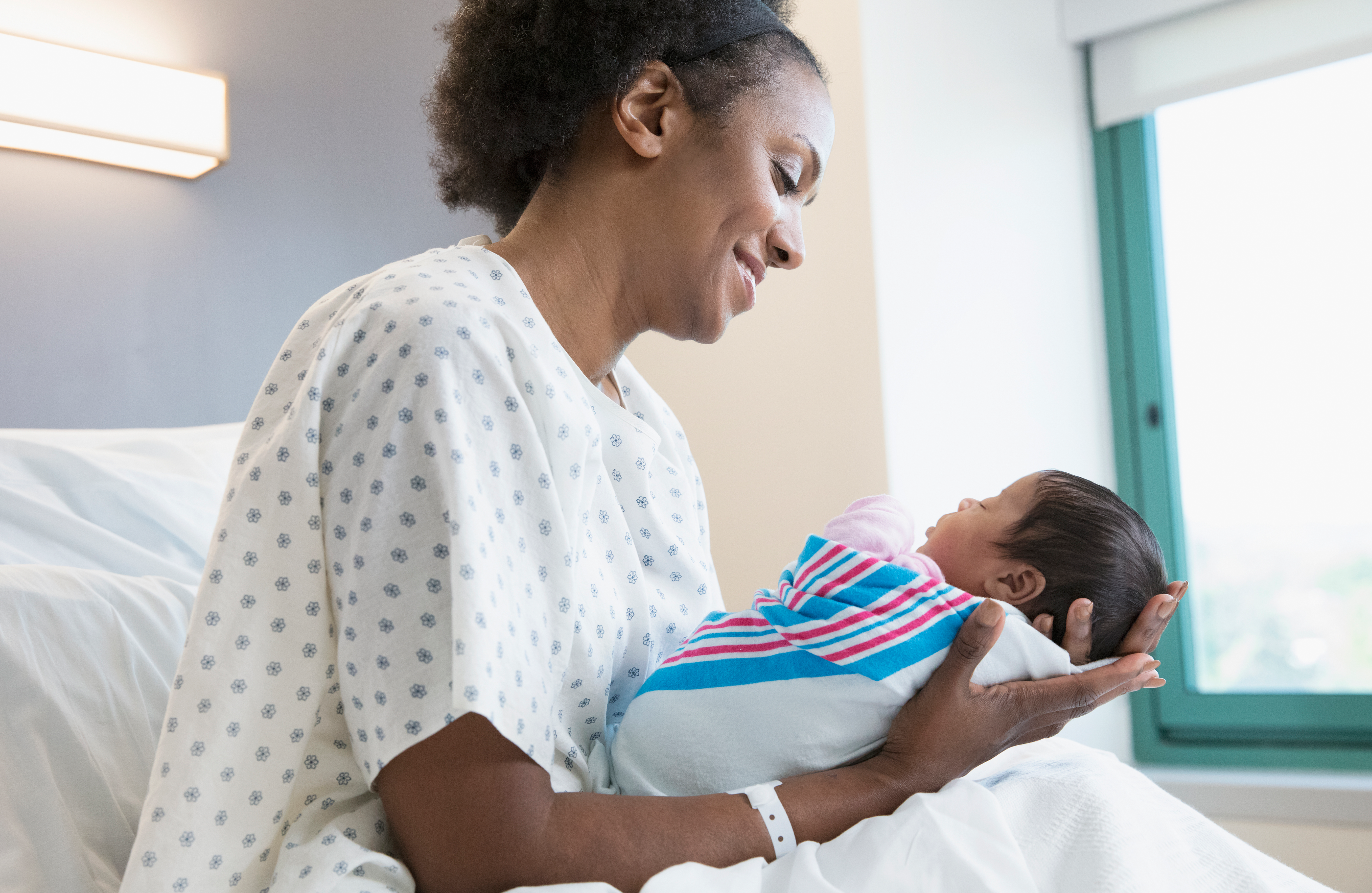 A nurse holding a baby
