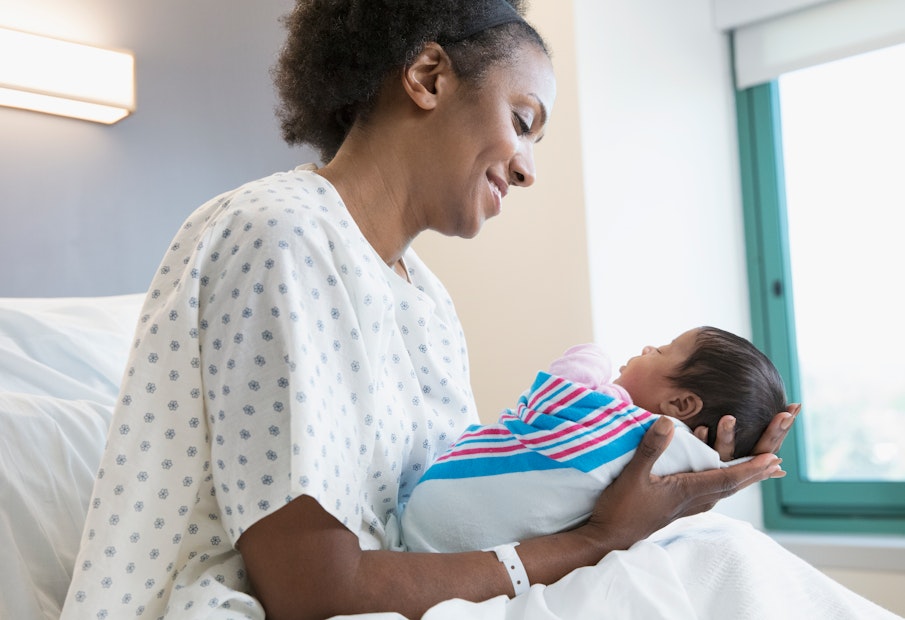 A nurse holding a baby