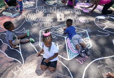 WASHINGTON, DC - JULY 14: Children and teachers from the KU Kids Deanwood Childcare Center complete a mural in celebration of the launch of the Child Tax Credit on July 14, 2021 at the KU Kids Deanwood Childcare Center in Washington, DC. (Photo by Jemal Countess/Getty Images for Community Change)
