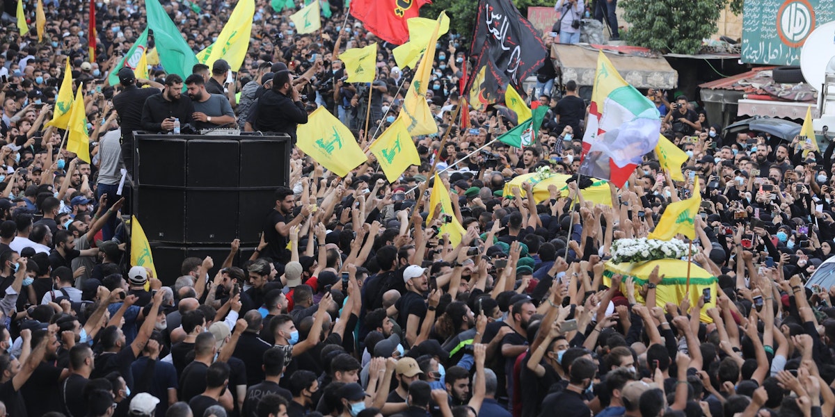 BEIRUT, LEBANON - OCTOBER 15: Supporters of Hezbollah mourn people killed in yesterday's clashes on October 15, 2021 in Beirut, Lebanon. On October 14th protests by the Hezbollah and Amal movements against the Beirut port explosion investigation left six people dead in a Christian quarter of the Lebanese capital, where civil war had sparked in 1975. (Photo by Marwan Tahtah/Getty Images)