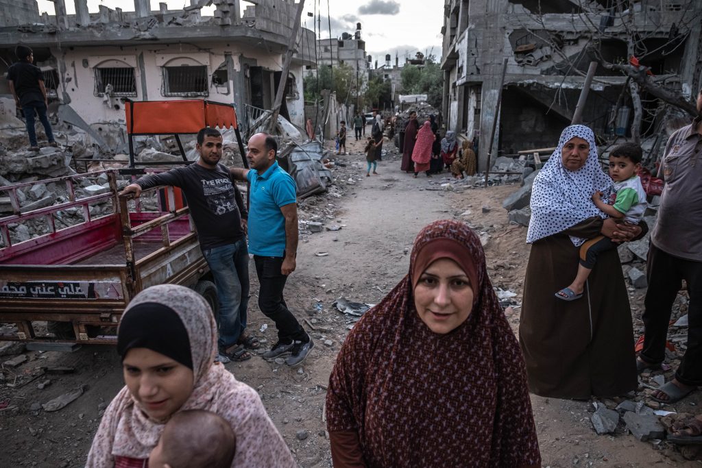 Palestinians in Gaza City inspect the rubble of their destroyed houses after a ceasefire between Israel and Gaza fighters on May 22, 2021. Source: Fatima Shbair/Getty Images