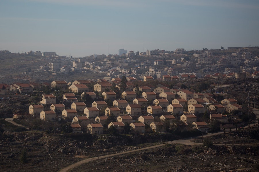 JERUSALEM, ISRAEL - JANUARY 15: Houses part of an Israeli settlement are seen in front of an Arab town on January 16, 2017 in Amona, West Bank. 70 countries attended the recent Paris Peace Summit and called on Israel and Palestinians to resume negotiations that would lead to a two-state solution, however the recent proposal by U.S President-elect Donald Trump to move the US embassy from Tel Aviv to Jerusalem and last month's U.N. Security Council resolution condemning Jewish settlement activity in the West Bank have contributed to continued uncertainty across the region. The ancient city of Jerusalem where Jews, Christians and Muslims have lived side by side for thousands of years and is home to the Al Aqsa Mosque compound or for Jews The Temple Mount, continues to be a focus as both Israelis and Palestinians claim the city as their capital. The Israeli-Palestinian conflict has continued since 1947 when Resolution 181 was passed by the United Nations, dividing Palestinian territories into Jewish and Arab states. The Israeli settlement program has continued to cause tension as new settlements continue to encroach on land within the Palestinian territories. The remaining Palestinian territory is made up of the West Bank and the Gaza strip. (Photo by Chris McGrath/Getty Images)