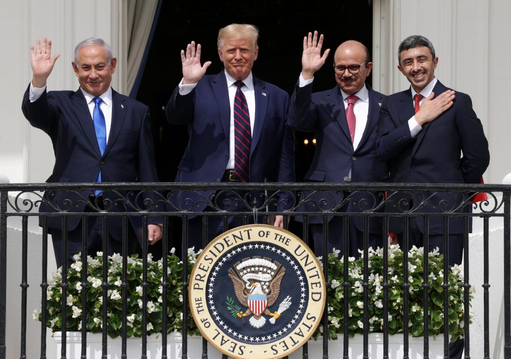 From left to right, Benjamin Netanyahu (then the Israeli prime minister), Donald Trump, Bahraini foreign affairs minister Abdullatif bin Rashid Al Zayani, and Emirati minister of foreign affairs Abdullah bin Zayed bin Sultan Al Nahyan wave from the Truman Balcony of the White House after the signing ceremony of the Abraham Accords on the South Lawn of the White House on September 15, 2020 in Washington, DC. Source: Alex Wong/Getty Images