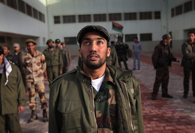 BENGHAZI, LIBYA - MARCH 01:  A rebel recruit tears up during his first day of military training at a rebel militia center on March 1, 2011 in Benghazi, Libya. Supporters of the Libyan opposition, which controls Benghazi and most of eastern Libya, have been eager to join militia groups, which have been fighting the forces of President Muammar Gaddafi to the west near the capitol Tripoli.  (Photo by John Moore/Getty Images)