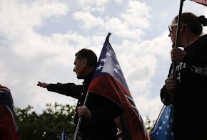 NEWNAN, GA - APRIL 21:  Members and supporters of the National Socialist Movement, one of the largest neo-Nazi groups in the US, hold a rally on April 21, 2018 in Newnan, Georgia. Community members have opposed the rally and have come out to embrace racial unity in the small Georgia town. Fearing a repeat of the violence that broke out after Charlottesville, hundreds of police officers are stationed in the town during the rally in an attempt to keep the anti racist protesters and neo-Nazi groups separated.  (Photo by Spencer Platt/Getty Images)