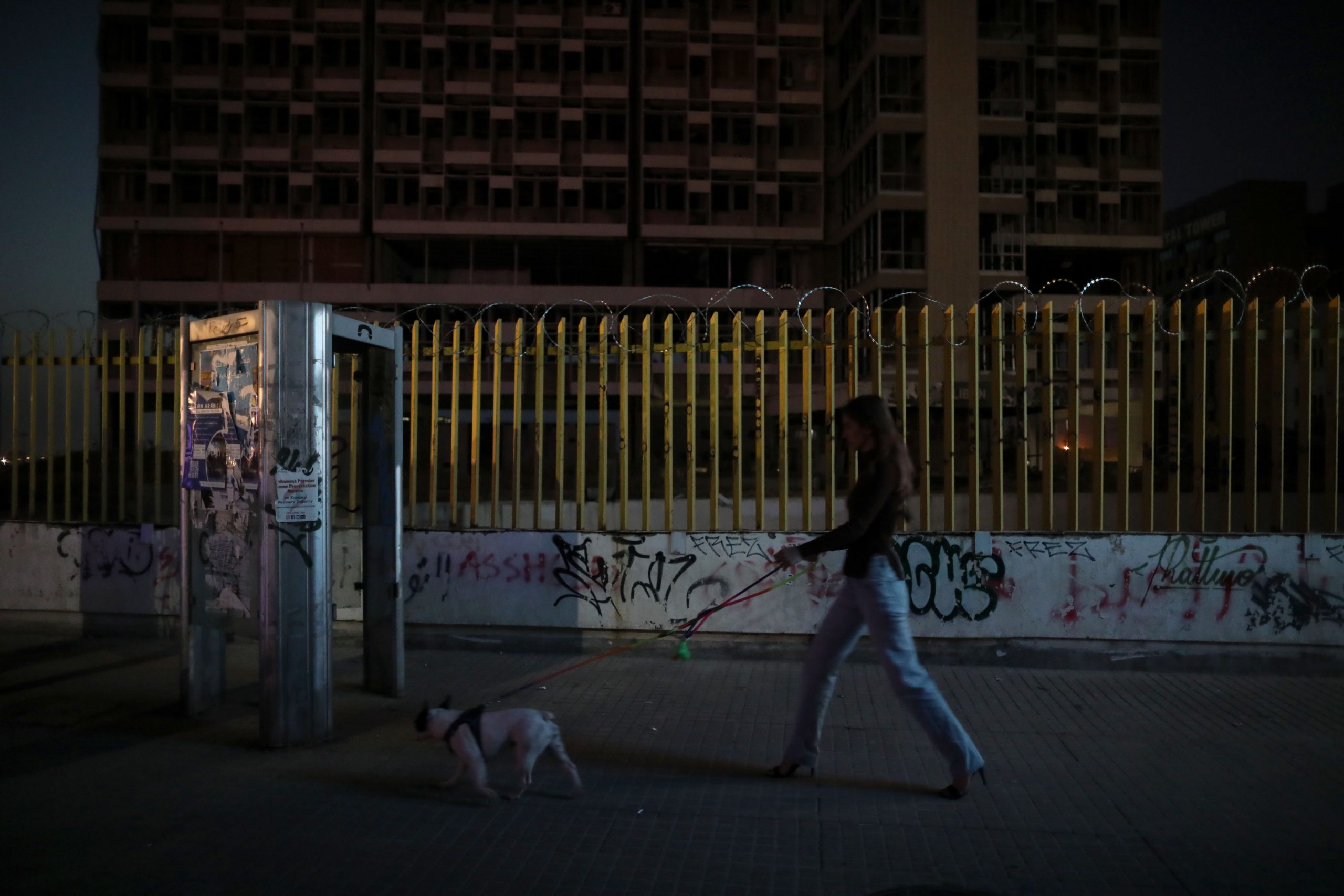 BEIRUT, LEBANON - APRIL 28: A women passing by the headquarters building of Lebanon Electricity company (EDL) on April 28, 2022 in Beirut, Lebanon. Lebanon's state-owned Electricite du Liban (EDL), generating 90% of the country's electricity production, transmission and distribution activities, provided a quote of 16 million USD to the government for half a day's worth of power at polling stations for the country's critical vote on May 15. (Photo by Marwan Tahtah/Getty images)