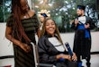 Portrait of woman in wheelchair on graduation day.