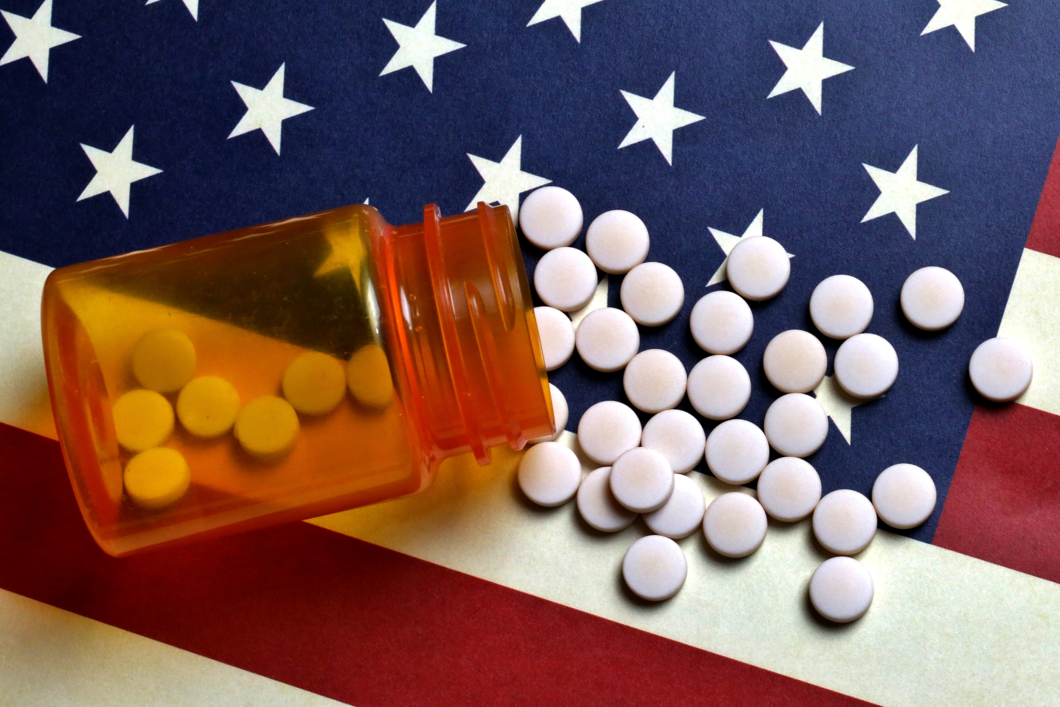 Prescription Pills spilled on USA flag
