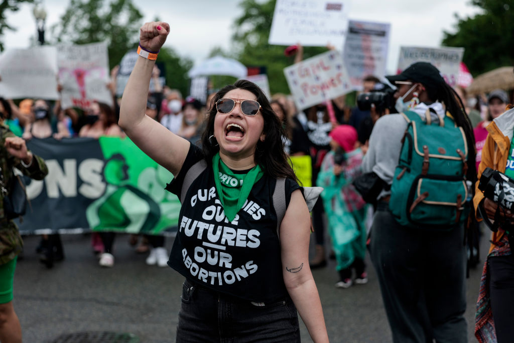 WASHINGTON, DC - MAY 14: Abortion-rights demonstrators yell as they walk down Constitution Avenue during the Bans Off Our Bodies march  on May 14, 2022 in Washington, DC. Abortion rights supporters are holding rallies around the country urging lawmakers to affirm abortion rights into law after a leaked draft from the U.S. Supreme Court exposed a potential decision to overturn Roe v. Wade. (Photo by Anna Moneymaker/Getty Images)