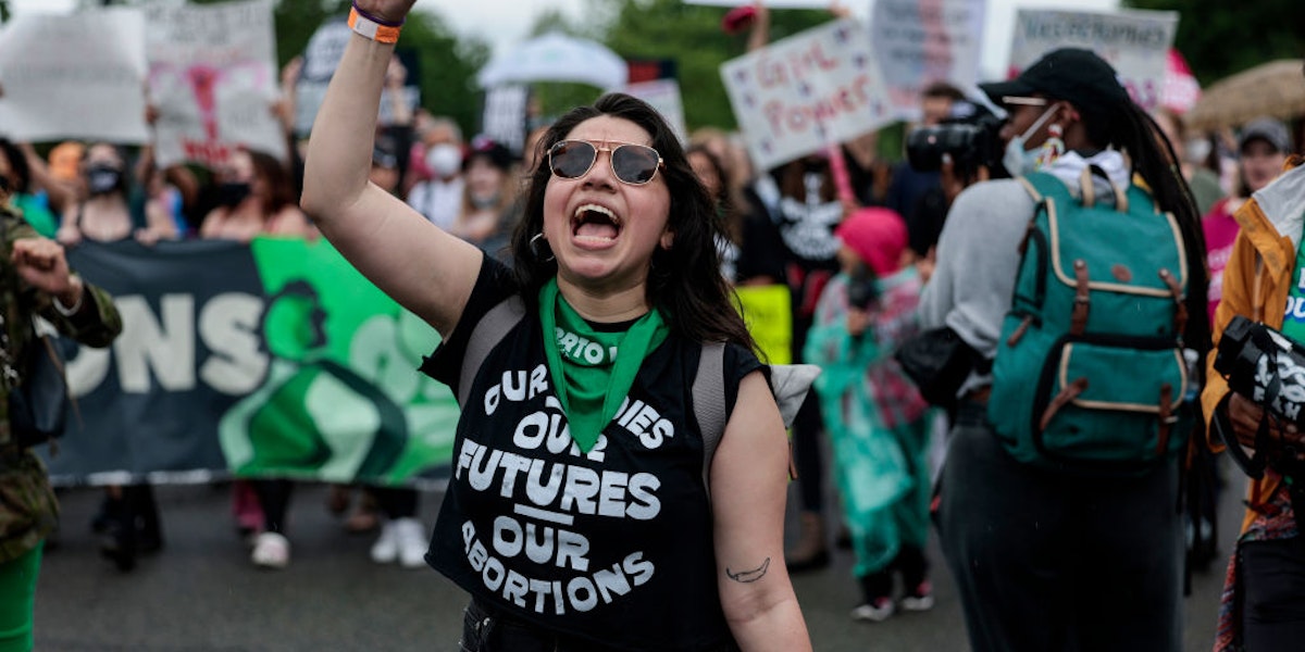 WASHINGTON, DC - MAY 14: Abortion-rights demonstrators yell as they walk down Constitution Avenue during the Bans Off Our Bodies march  on May 14, 2022 in Washington, DC. Abortion rights supporters are holding rallies around the country urging lawmakers to affirm abortion rights into law after a leaked draft from the U.S. Supreme Court exposed a potential decision to overturn Roe v. Wade. (Photo by Anna Moneymaker/Getty Images)