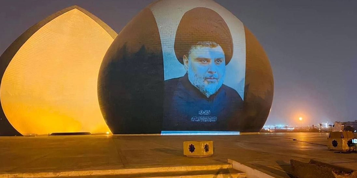 Muqtada al-Sadr’s image is projected onto Baghdad’s Martyr’s Monument.