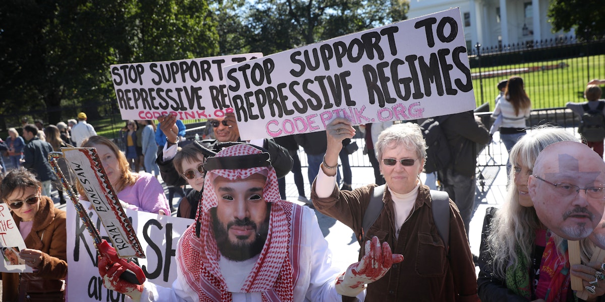 WASHINGTON, DC - OCTOBER 19: A protester dressed as Saudi Arabian crown prince Mohammad bin Salman, demonstrates with members of the group Code Pink outside the White House in the wake of the disappearance of Saudi Arabian journalist Jamal Khashoggi October 19, 2018 in Washington, DC. Khashoggi has disappeared following a meeting at the Saudi consulate in Istanbul on October 2, 2018. (Photo by Win McNamee/Getty Images)