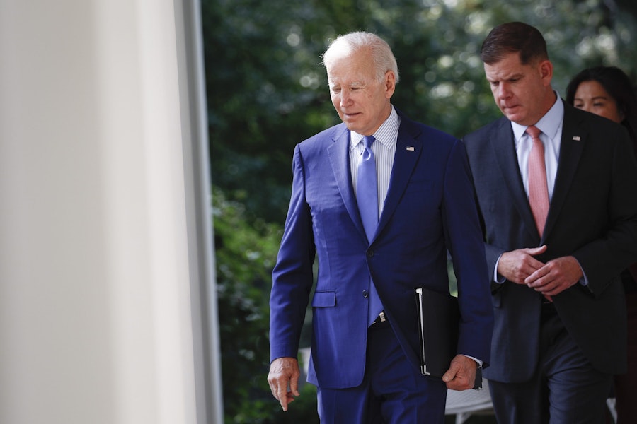 WASHINGTON, DC - SEPTEMBER 15: U.S. President Joe Biden walks with Labor Secretary Marty Walsh before an event in the Rose Garden of the White House September 15, 2022 in Washington, DC. During the event Biden announced a tentative labor agreement between freight rail companies and unions representing tens of thousands of workers. (Photo by Anna Moneymaker/Getty Images)