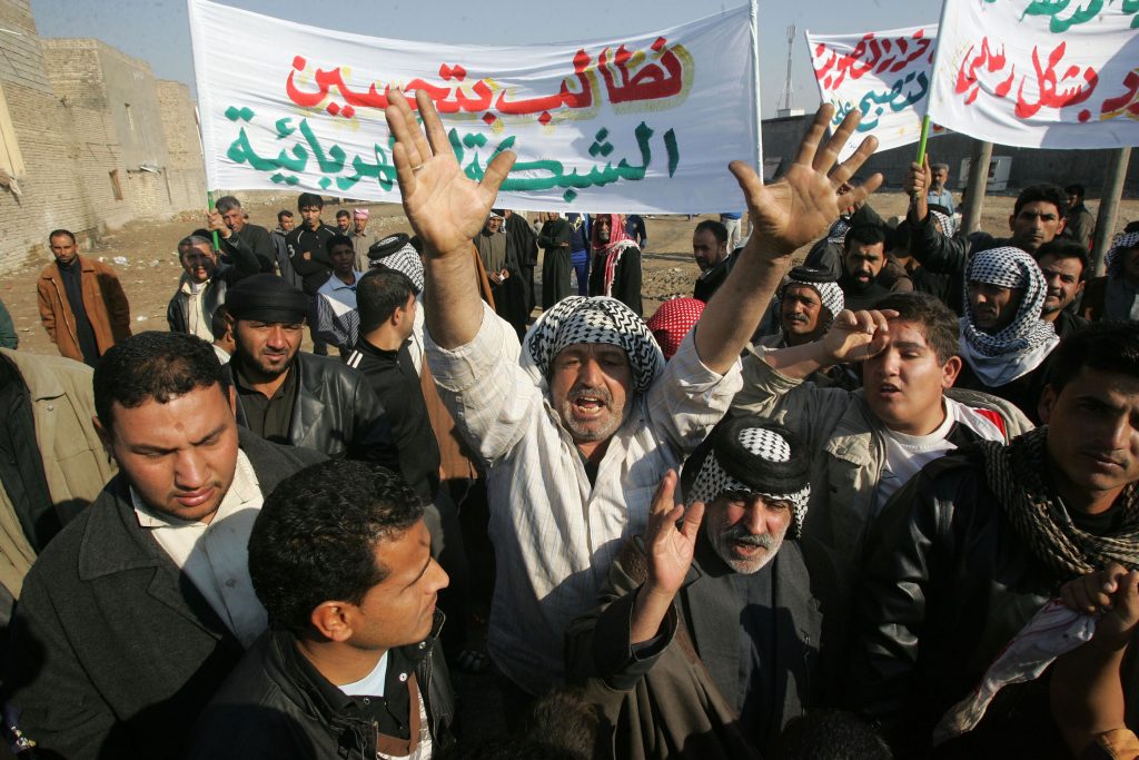 Iraqis chant slogans during a demonstration demanding better municipal services February 11, 2011 in Baghdad, in the final months of the American occupation. Corruption has only accelerated in the last decade.
