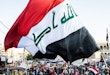 BAGHDAD, IRAQ - NOVEMBER 21: A flag waves over Tahrir Square on Nov. 21, 2019 in Baghdad, Iraq. Thousands of demonstrators have occupied Baghdad's center Tahrir Square since October 1, calling for government and policy reform. For many, Tahrir Square - which demonstrators are calling 