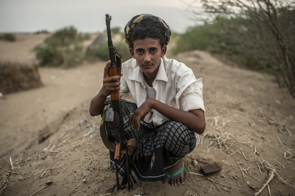 A Tahami Resistance fighter, a militia aligned with Yemen's Saudi-led coalition-backed government, sits at a frontline east of the city on September 20, 2018 in Hodeidah, Yemen.
