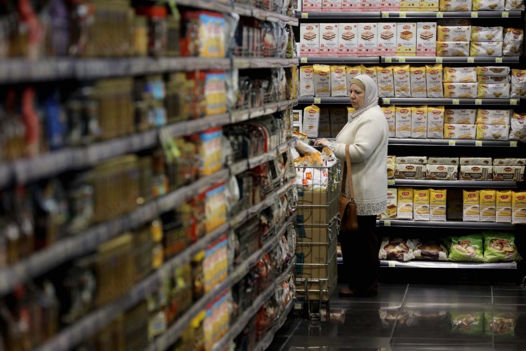 A woman shops in a supermarket after the dollarization of product prices on March 31, 2023 in Beirut.