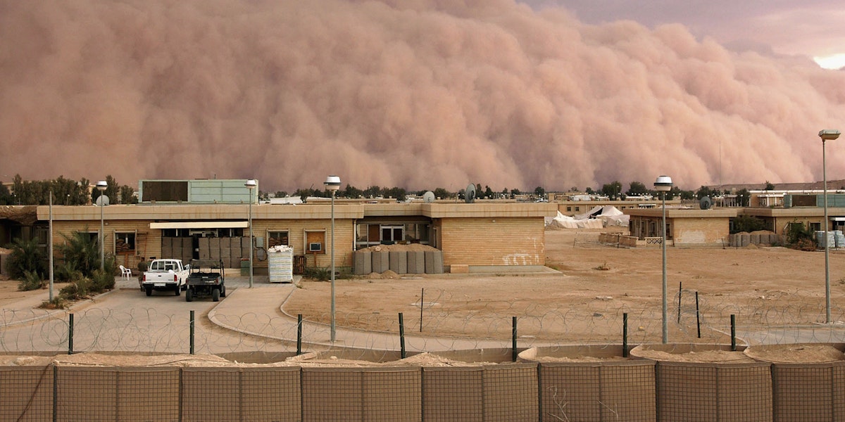 A dust storm bellows across the western desert of Iraq in April 2005. Sand and dust storms have become more frequent and devastating in recent years. Source: Shannon Arledge/USMC via Getty Images
