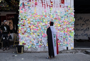 BAGHDAD, IRAQ - NOVEMBER 22: Demonstrators paste wishes on post-it notes on the 