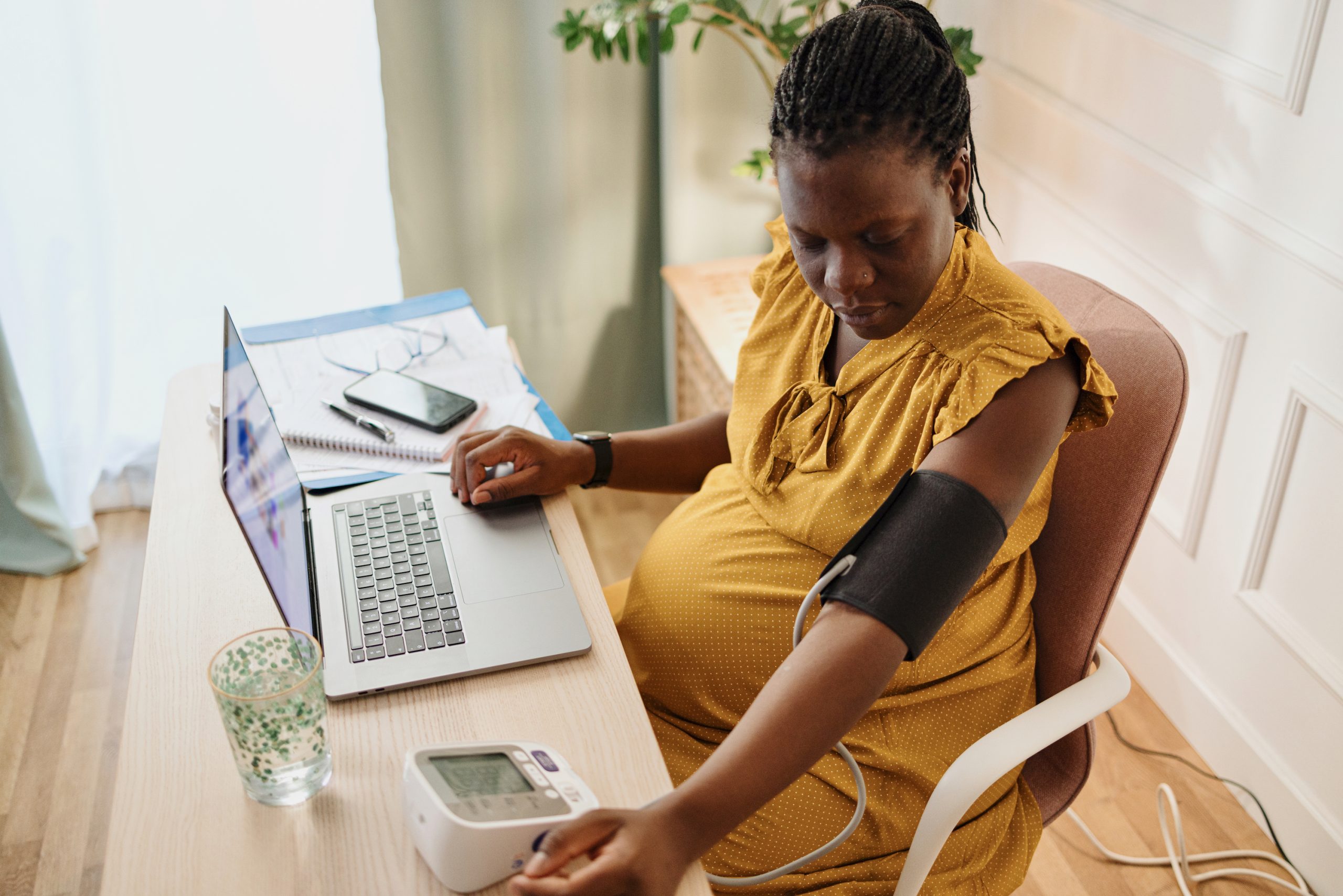 Pregnant woman working in her office