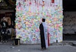 BAGHDAD, IRAQ - NOVEMBER 22:  Demonstrators pastes wishes on post-it notes on the 