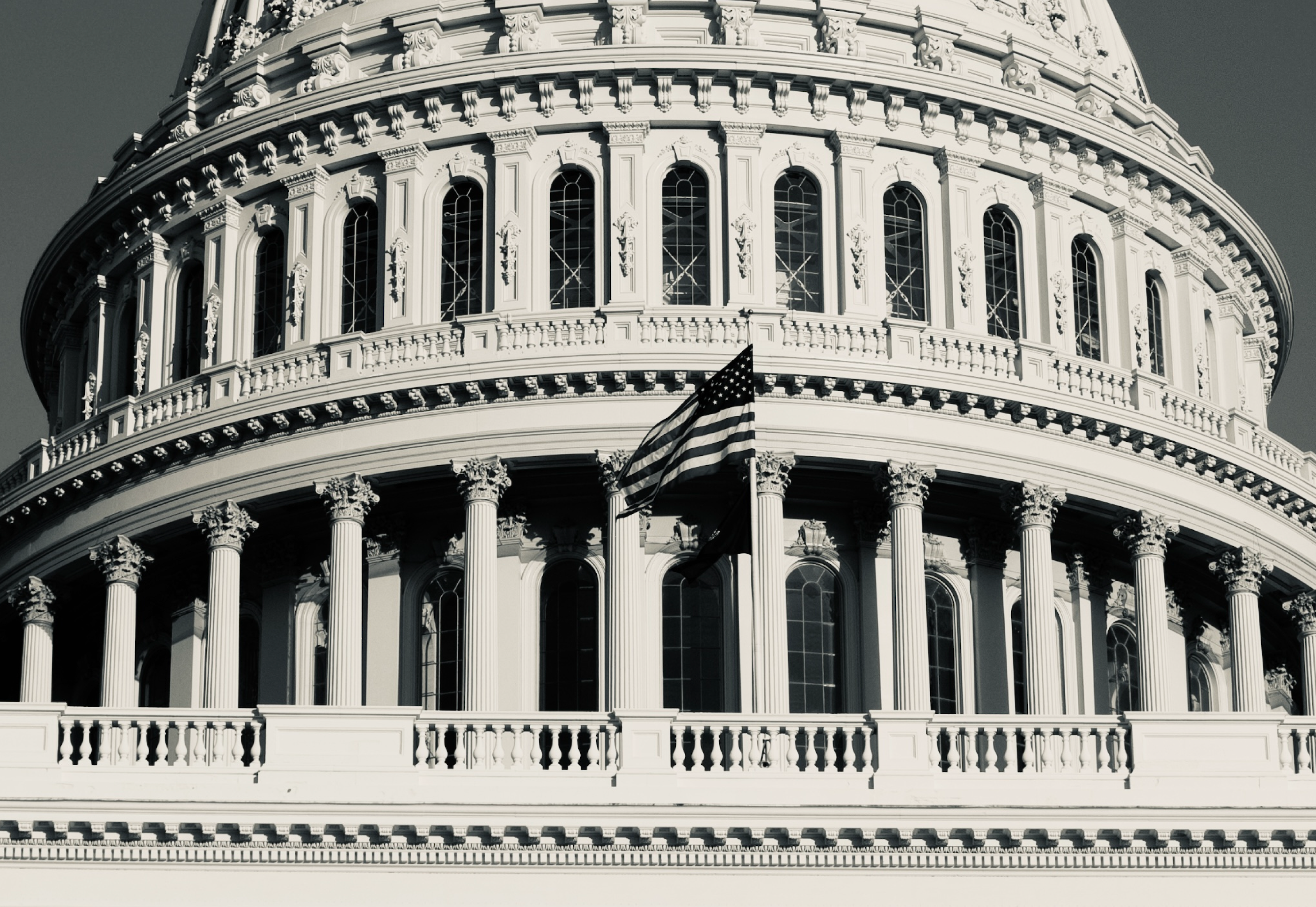 A grayscale image of the Capitol building.