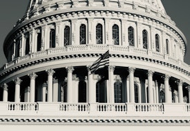 A grayscale image of the Capitol building.