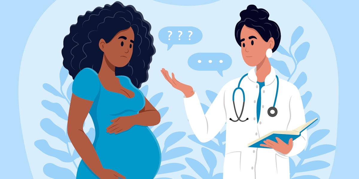 A Black pregnant woman is talking with her health care provider and seems confused.