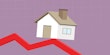 An illustrated graphic showing a house balancing on a downward trending arrow, representing decreasing housing prices.