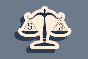 A dark blue scale holding a money icon on one side and a house icon on the other.