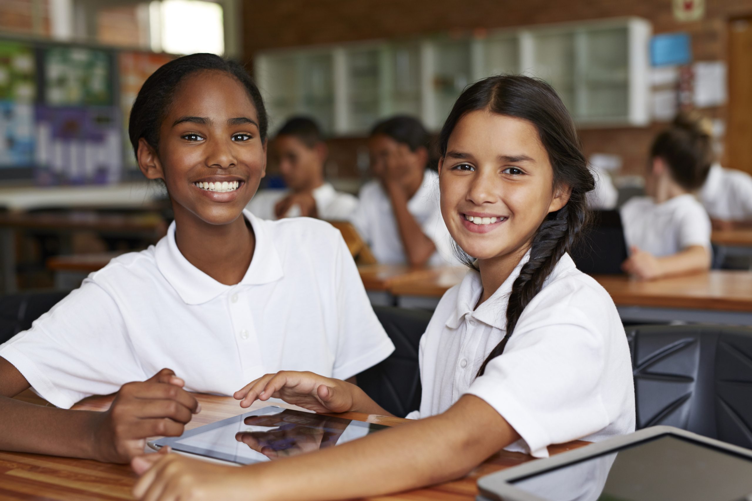 School students in class working with tablets