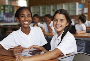 School students in class working with tablets
