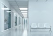 Empty corridor in modern hospital with waiting area and hospital bed in rooms.3d rendering