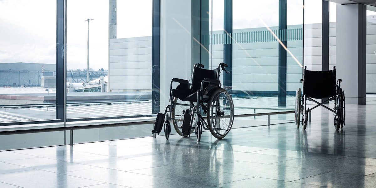 Wheelchairs in a modern airport. Wheelchairs ready for use by passangers with disabilities
