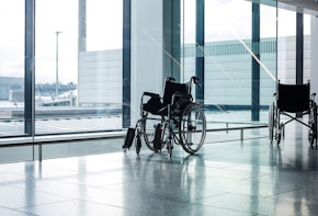 Wheelchairs in a modern airport. Wheelchairs ready for use by passangers with disabilities