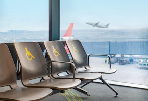 Empty disabled seats at an airport in the waiting area before boarding.