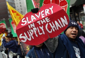 NEW YORK, NY - FEBRUARY 28:  Members and supporters of the Coalition of Immokalee Workers (CIW) protest outside a Trader Joes store in Manhattan February 28, 2011 in New York City. The Florida farmworkers pick tomatoes for Trader Joes and other companies and are asking for workplace conditions to improve and for wages, which havent been raised since 1978, to be increased. The workers say Trader Joes has refused to sign a food pledge to pay an extra penny per pound of tomatoes.  (Photo by Mario Tama/Getty Images)