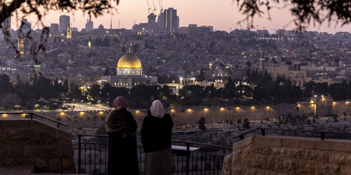 JERUSALEM, ISRAEL - DECEMBER 29: Palestinian women stand at Rekhav'am Observation Point at the Mount of Olives with Al-Aqsa Mosque in the backgroundon December 29, 2023 in Jerusalem. Israel's PM Netanyahu announced an intensification of the fighting in Gaza whilst facing  internal pressure to save hostages. Israel indicated 129 people remain unaccounted for after they were taken as hostages to Gaza during the October 7 attacks by Hamas. (Photo by Maja Hitij/Getty Images)