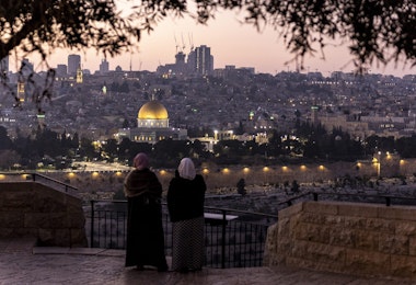 JERUSALEM, ISRAEL - DECEMBER 29: Palestinian women stand at Rekhav'am Observation Point at the Mount of Olives with Al-Aqsa Mosque in the backgroundon December 29, 2023 in Jerusalem. Israel's PM Netanyahu announced an intensification of the fighting in Gaza whilst facing internal pressure to save hostages. Israel indicated 129 people remain unaccounted for after they were taken as hostages to Gaza during the October 7 attacks by Hamas. (Photo by Maja Hitij/Getty Images)