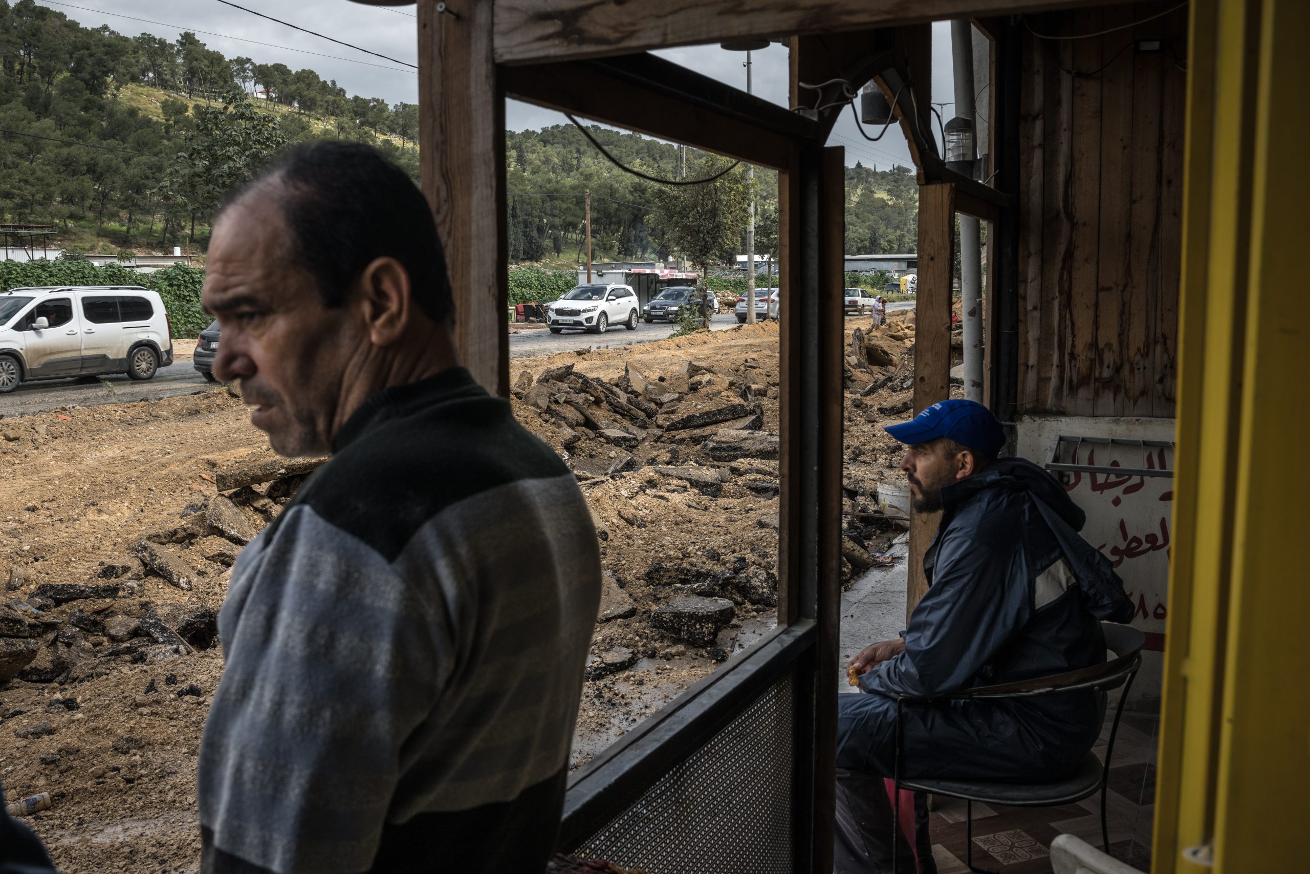 NUR SHAMS, WEST BANK - MARCH 4:  Palestinian shop owners survey the destroyed pavement of the road on front of the shop following an Israeli raid in the Nur Shams camp near Tulkarem on March 4, 2024, West Bank. Israel's war against Hamas in Gaza has also reverberated through the West Bank, hobbling the territory's economy while unsettling its security. Since Oct. 7, Israeli forces have stepped up raids on alleged militants, police have clashed with protesters, and there has been a rise in violent attacks on Palestinians by Israeli settlers.  (Photo by Sergey Ponomarev/Getty Images)