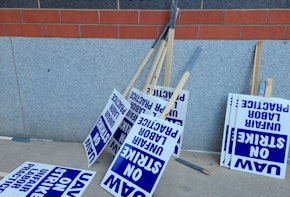 artificial intelligence taking over jobs essay introduction Labor union on strike picketing signs resting on a wall.