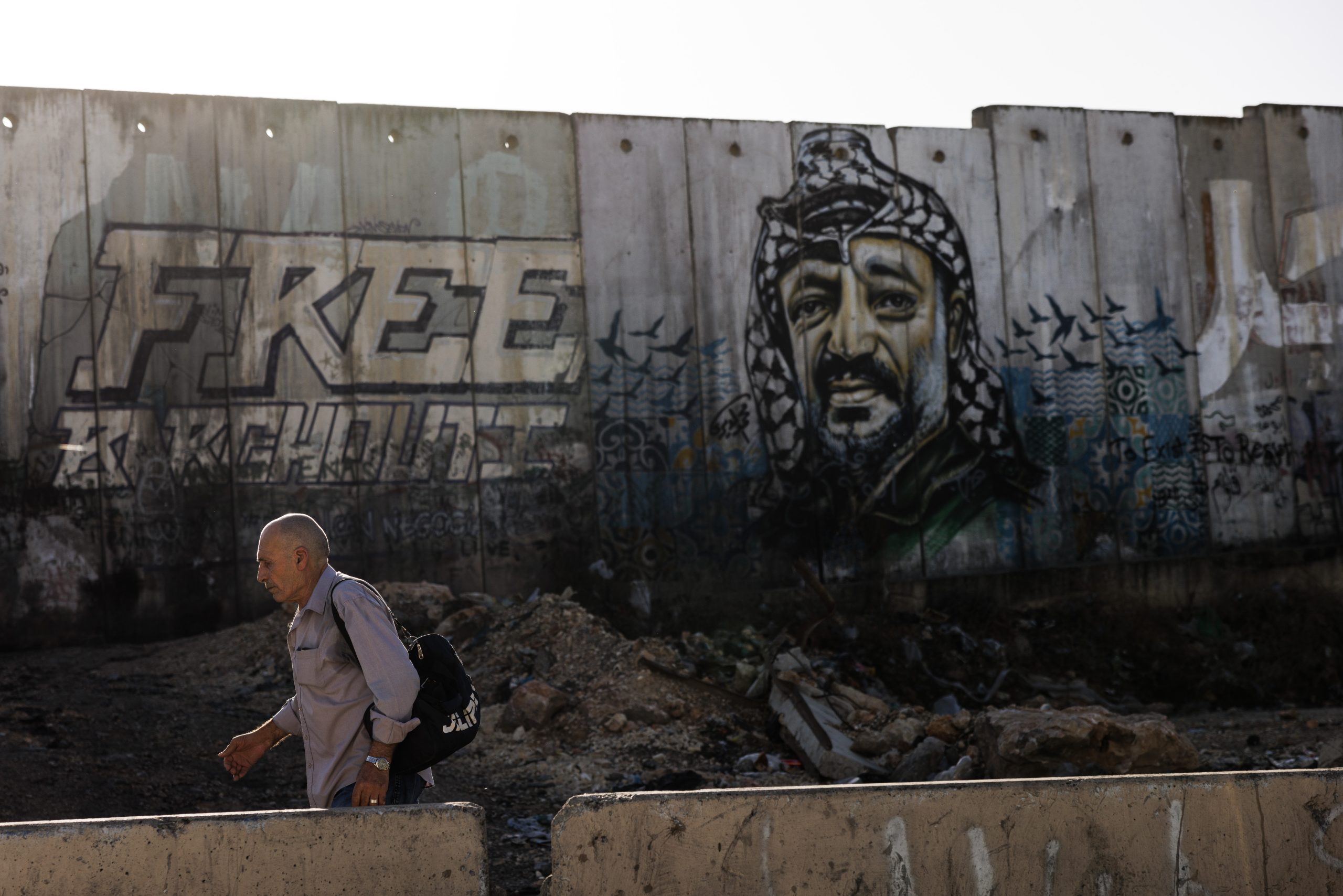 A mural on Israel's controversial separation wall between Jerusalem and Ramallah depicting the former chairman of the Palestine Liberation Organization, Yasser Arafat, in November 2023 in Ramallah, West Bank. Source: Dan Kitwood/Getty Images