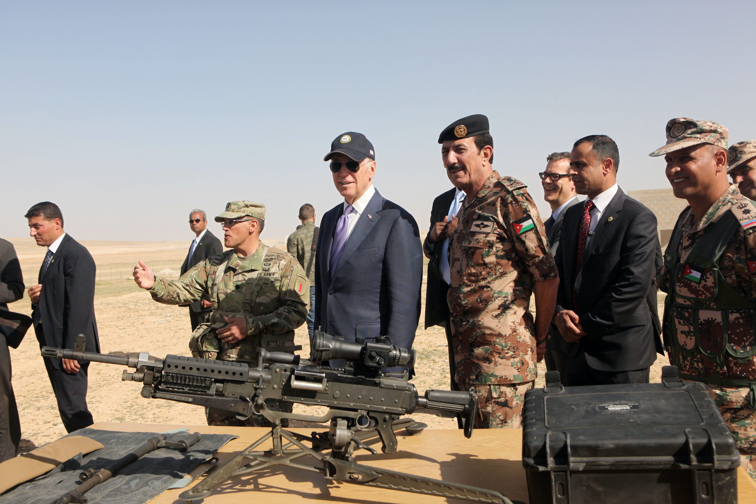 In a 2016 photo, Joe Biden, then the vice president, reviews weapons and troops during a visit to a joint Jordanian–American training center northeast of Amman. Source: Jordan Pix/Getty Images