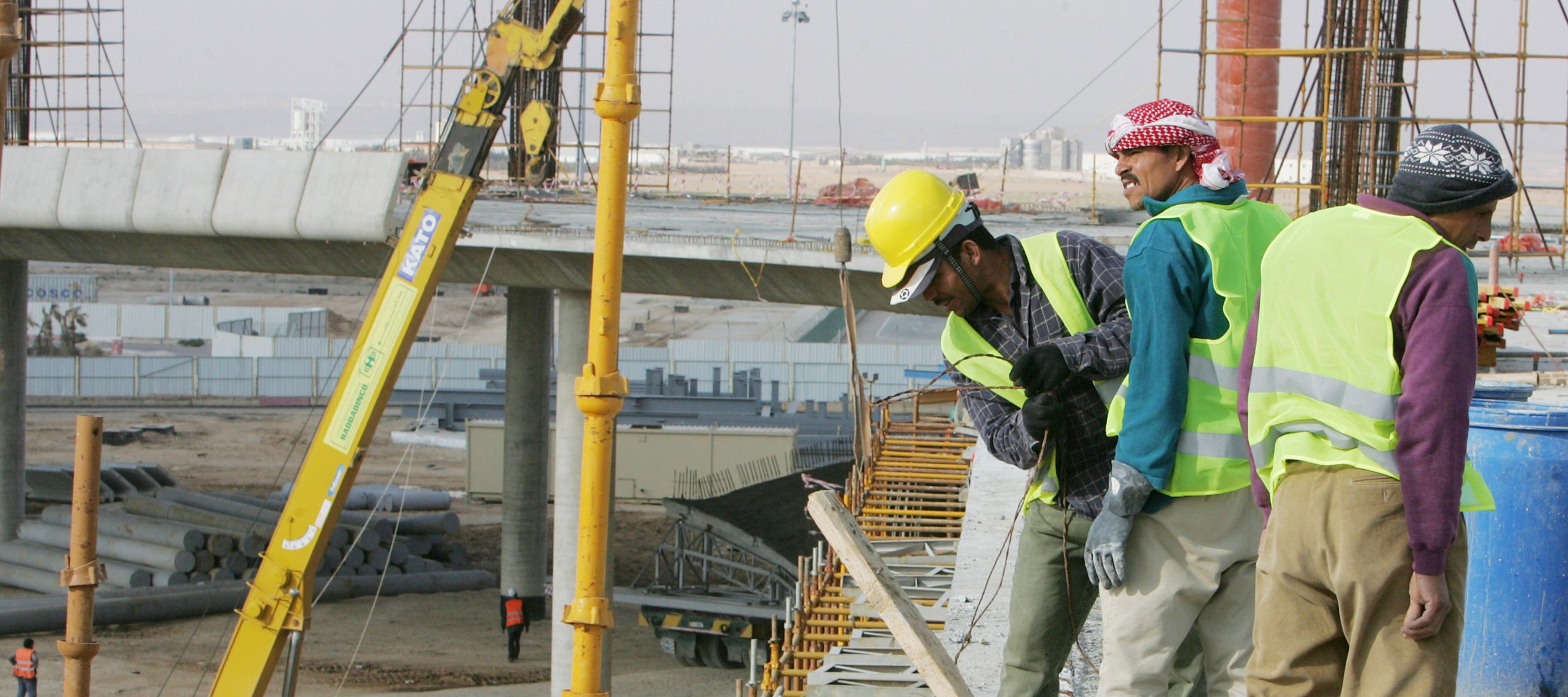 Laborers work on a bridge on a large construction site.Credit : ILO/Apex ImageDate : 2010Country : Jordan