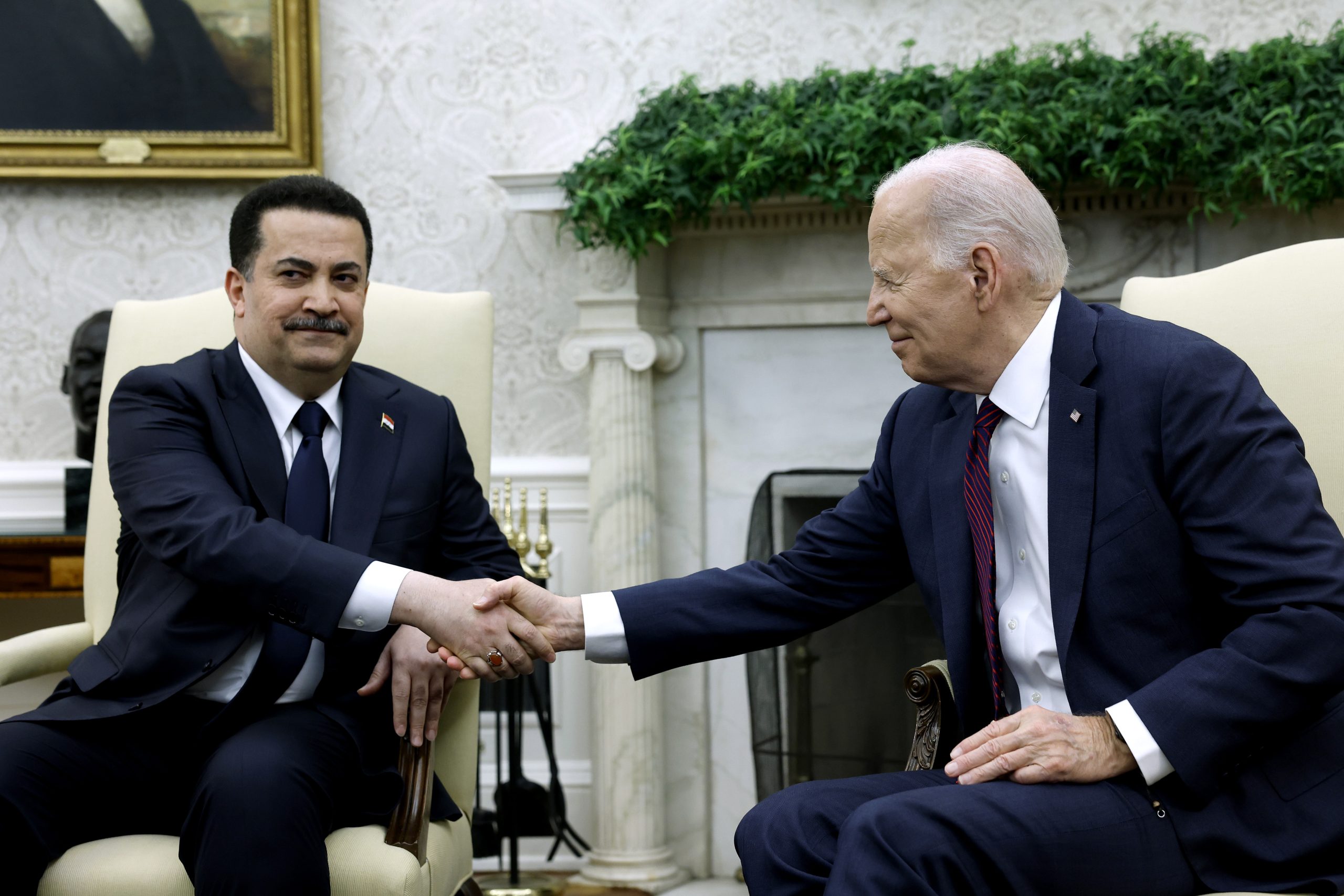 WASHINGTON, DC - APRIL 15: U.S. President Joe Biden and Iraqi Prime Minister Mohammed Shia al-Sudani shake hands in the Oval Office of the White House on April 15, 2024 in Washington, DC. Biden and al-Sudani intend to speak on Iran’s drone strike on Israel over the weekend. Al-Sudani’s visit to the U.S. was already arranged last month with the intention to also discuss a range of topics pertaining to economic, trade and energy issues. (Photo by Anna Moneymaker/Getty Images)