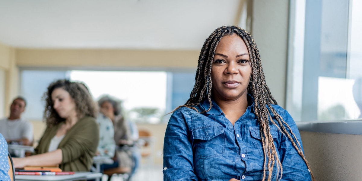Portrait of adult black female student in classroom