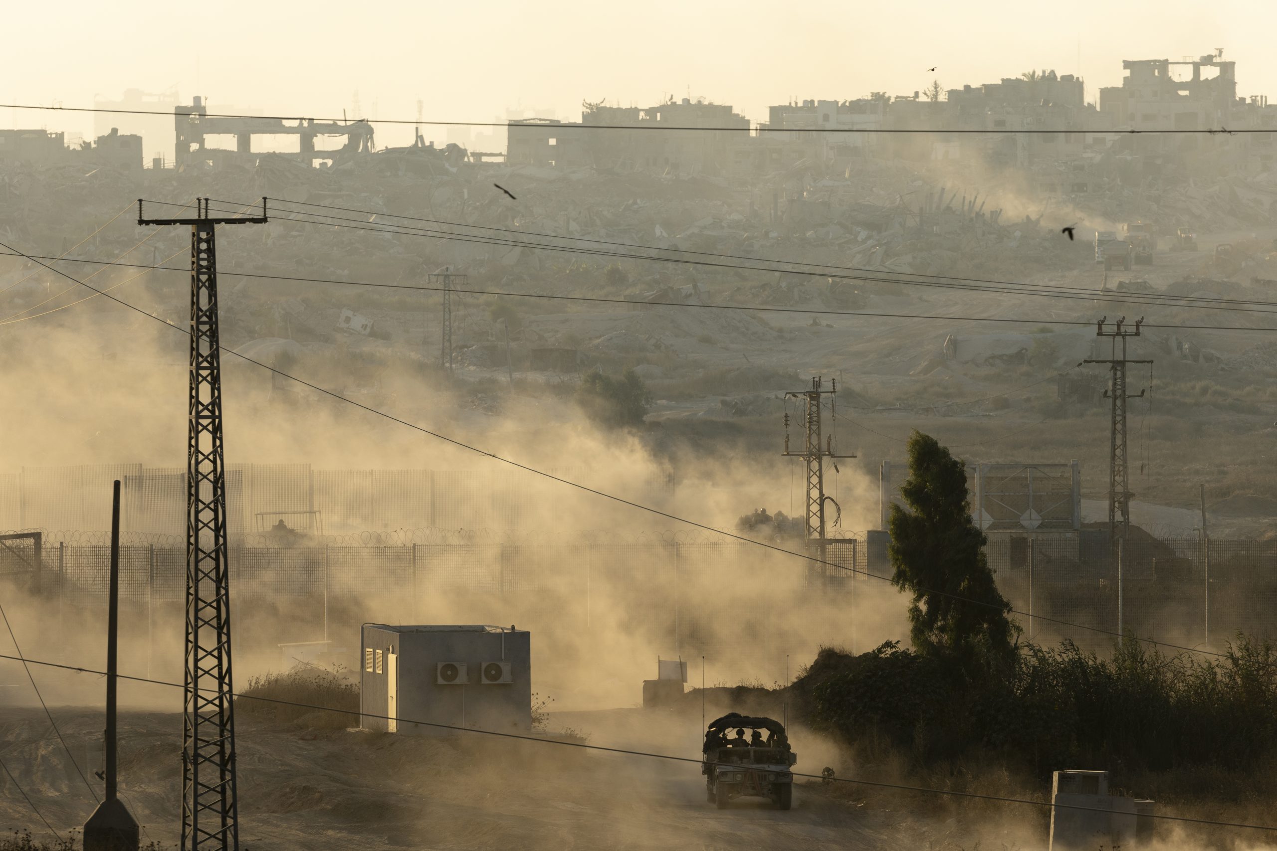 An Israeli army vehicle leaves the Gaza Strip, as seen from a position on the Israeli side of the border on July 3. The Gaza war has so far strengthened the Saudi–Iranian détente. Source: Amir Levy/Getty Images